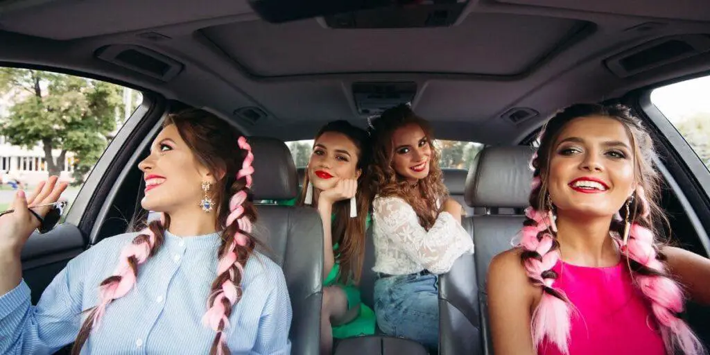 Girl Riding car with friends